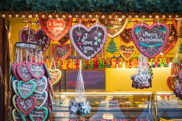 Gingerbread hearts on display at a confectionery stall of Christmas market winter wonderland in London