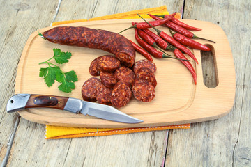 whole chorizo on a cutting board