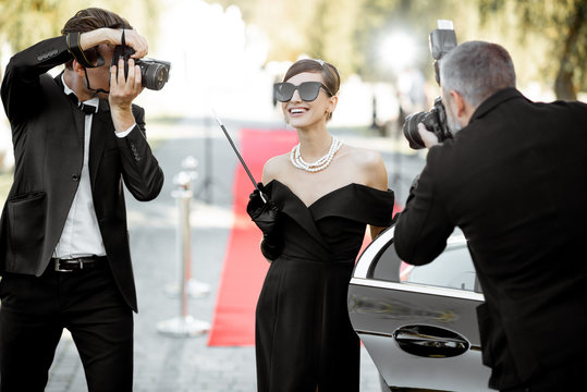 Photo reporters photographing actress ariving on the awards ceremony