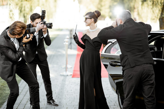 Photo reporters photographing actress ariving on the awards ceremony