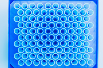 Top view of empte blue test tubes background. Science, chemistry, biology and medicine concept