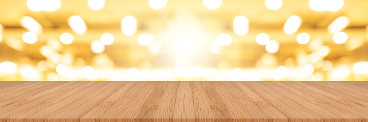 Fototapeta na wymiar wooden pine table on top over blur background, can be used mock up for montage products display or design layout.