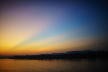 sunrise over the mountains and river background