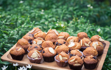Mini banana muffins on wooden plate