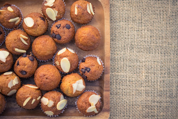 Mini banana muffins on wooden plate