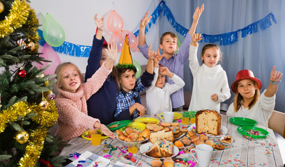 Boys and girls behaving jokingly during friend’s birthday party