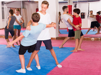 Fototapeta na wymiar Kids exercising self-defense movements