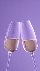 two glasses with champagne on a purple background