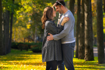 Fototapeta premium Young pregnant woman hugging her husband