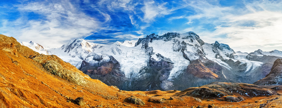Alpine mountain ridge on border of Switzerland and Italy. Beautiful panoramic mountain landscape. View on Monte Rosa and Gorner Glacier, Zermatt, Canton Valais, Wallis in Switzerland.