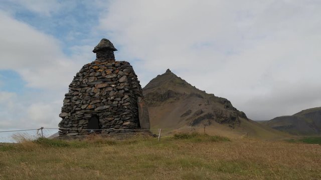 A monument made of stones in Hellnar, West Iceland