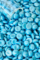 Close up of high-density polyethylene (HDPE) granules, selective focus.