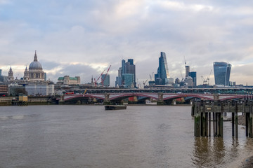 Fototapeta na wymiar Cityscape of London from Queen's Walk on the south bank of the River Thames