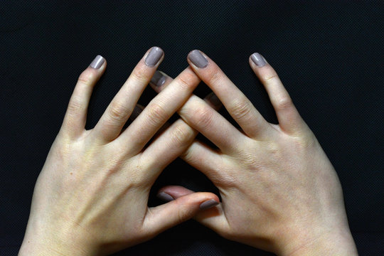 Female hands with long fingers