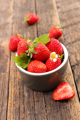 strawberry in bowl and leaf