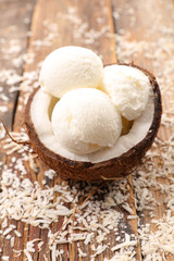 Fototapeta na wymiar coconut ice cream on wood background