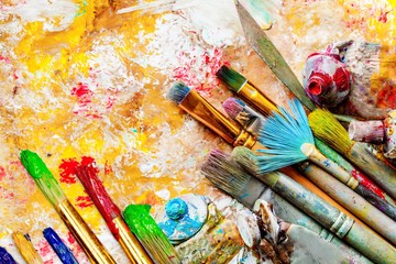 Row of artist paint brushes  on background