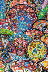 Colorful pottery dishes in Dubai souks, Unied Arab Emirates
