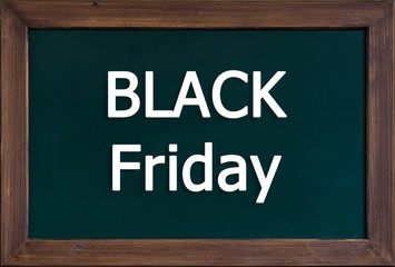 die W&ouml;rter Black Friday auf einer Schreibtafel mit Holzrand