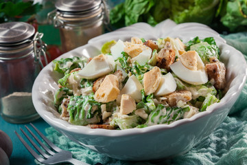 Healthy caesar salad with cheese, eggs and croutons