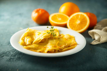 Homemade crepes with orange sauce
