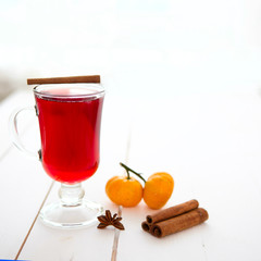 Mulled wine in glass with cinnamon stick isolated