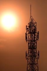 Telecommunication tower Antenna and satellite dish at sunset sky backgroundommunication tower...