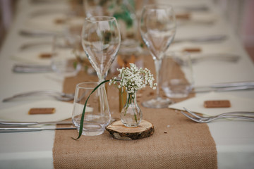 Outdoor catering dinner at the wedding with homemade garnishes decoration