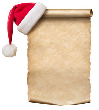 Old paper scroll and red christmas hat isolated on white