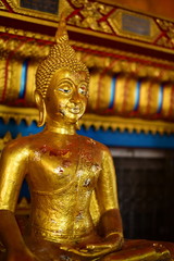 Fototapeta premium Golden statue of buddha in temple, Thailand