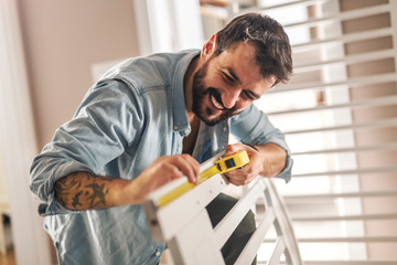 Assembling a wooden crib for baby