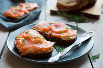 Sandwithes with smoked salmon and creamy cheese on bread