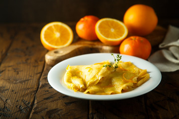 Homemade crepes with orange sauce