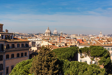 Fototapeta na wymiar Rome rooftop city view and dome St. Peter's cathedral. Italy