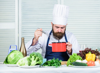 Cuisine culinary. Vitamin. Healthy food cooking. Mature hipster with beard. Dieting organic food. Vegetarian salad with fresh vegetables. serious bearded man. chef recipe. Looking good