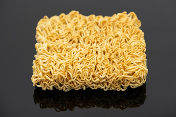 Raw instant noodle ready to cook isolated on black background