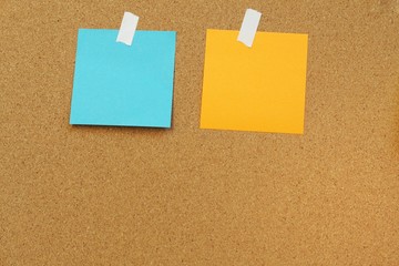 Sticky and pin blank paper notes on cork board to remind.