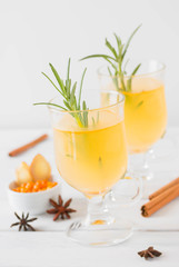 Seabuckthorn spicy drink with honey, ginger, cinnamon and star anise.