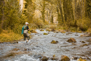 Man fishing a river