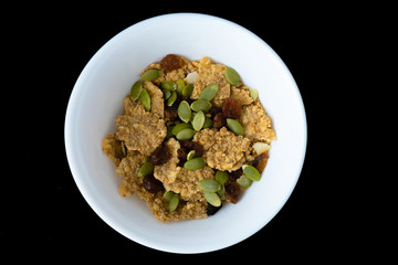 Variety of cold cereals in white bowls, quick breakfast for kids overhead shot with copyspace