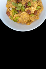 Variety of cold cereals in white bowls, quick breakfast for kids overhead shot with copyspace