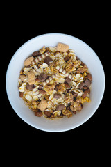 Variety of cold cereals in white bowls, quick breakfast for kids overhead shot with copyspace