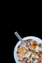 Variety of cold cereals in white bowls, quick breakfast for kids overhead shot with copyspace