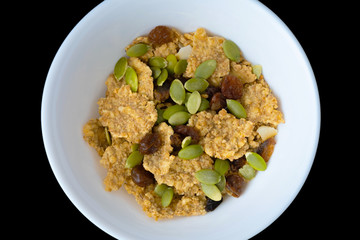 Variety of cold cereals in white bowls, quick breakfast for kids overhead shot with copyspace