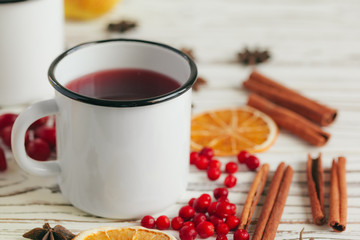 Autumn composition with hot mulled wine and spices on wooden background