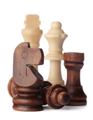 White and brown wooden chess pieces on white background
