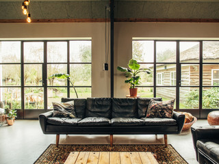 Danish design midcentury modern style sofa in a loft style livingroom