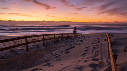 Fototapeta na wymiar Sunrise after a storm on the beach.