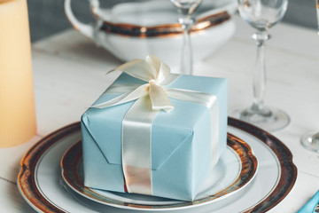 Close up shot of table setting for fine dining with cutlery and glassware