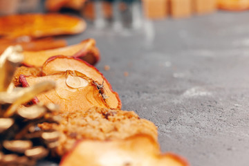 Dried fruit slices with cookies close up on kitchen table